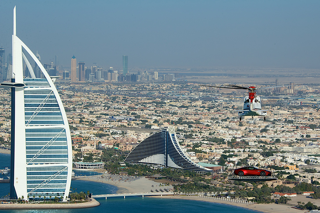 An Aston Martin Vanquish heads to the helipad of the Burj Al Arab hotel in Dubai