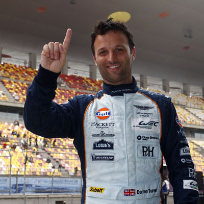 Aston Martin Works Driver Darren Turner celebrates victory at the Chinese track