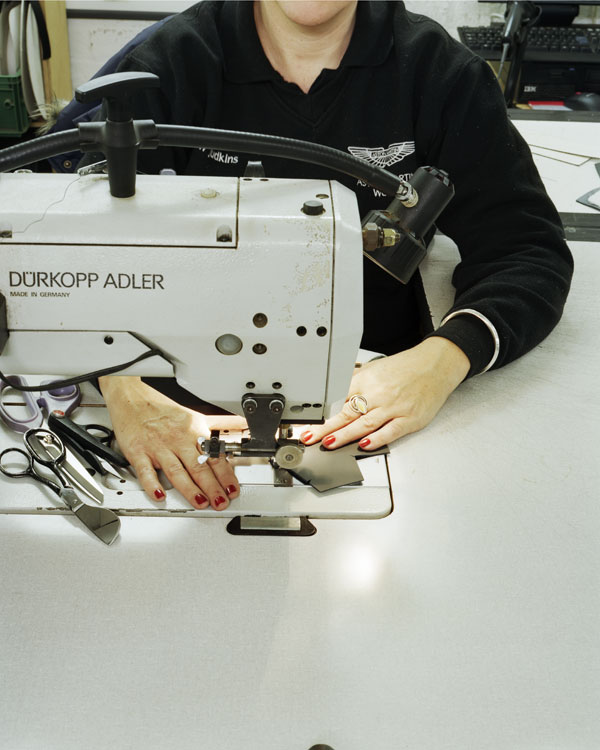 Helen gets to work on another seat cover on one of her trusty sewing machines